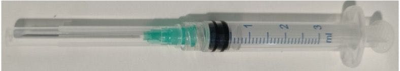 23-gauge needle with a cap and disposable syringe