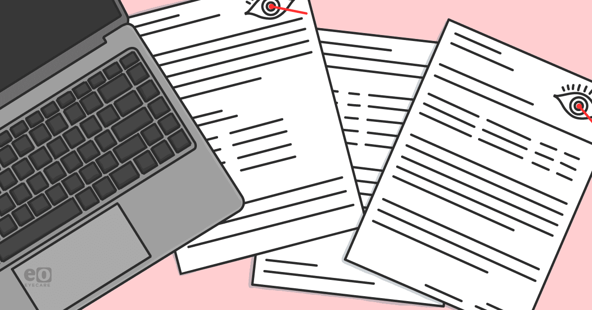 Image of medical records next to a laptop to represent coding and billing tips for new ophthalmologists.